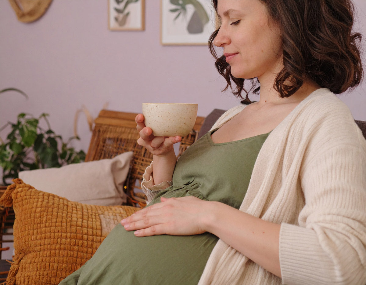 Pregnant women drinking herbal tea